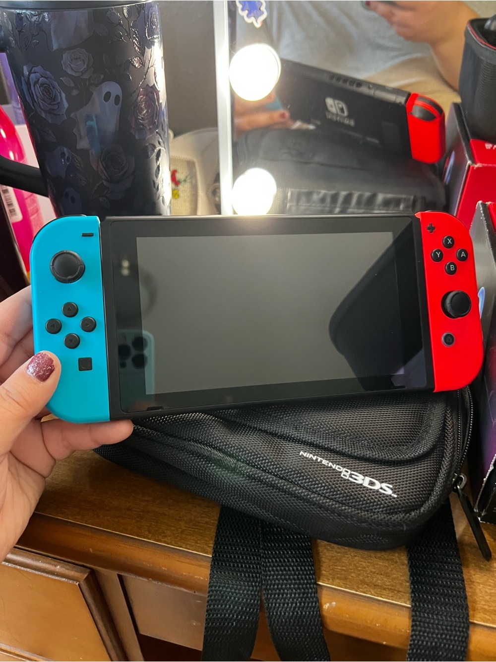 Nintendo Switch with Neon Blue and Neon Red Joy-Con